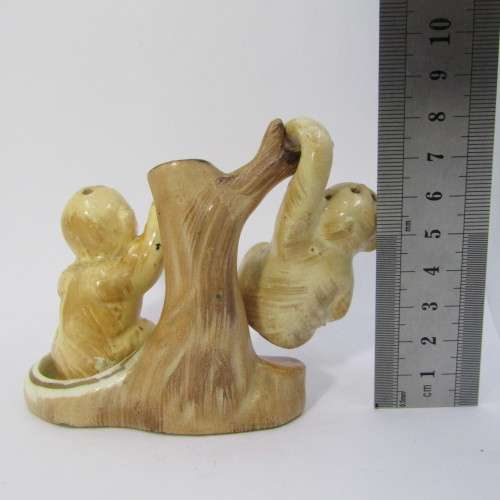 Pair of vintage Monkeys salt and pepper shakers on tree stand