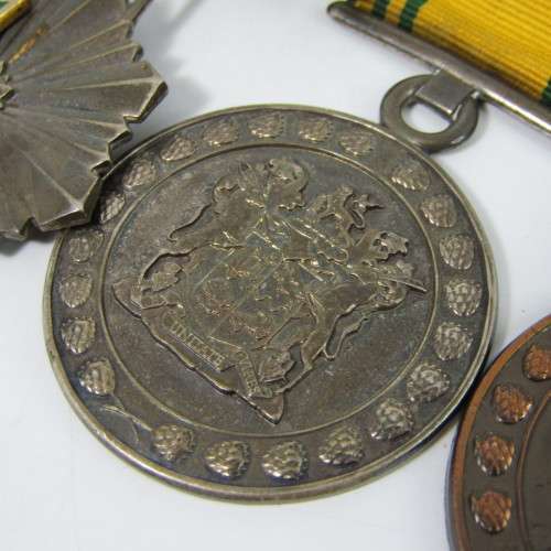 Set of 4 SA Prison Service medals issued to 12612 - H Warrant Officer IL Theunissen