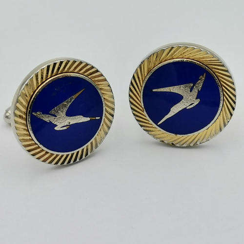 Pair of South African Airways flying springbok cufflinks with blue background