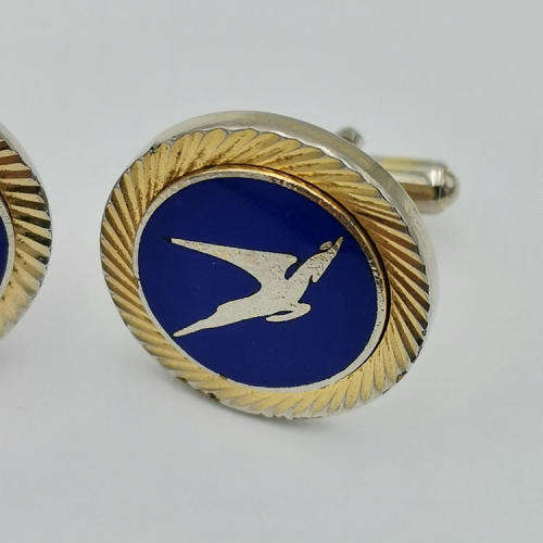 Pair of South African Airways flying springbok cufflinks with blue background