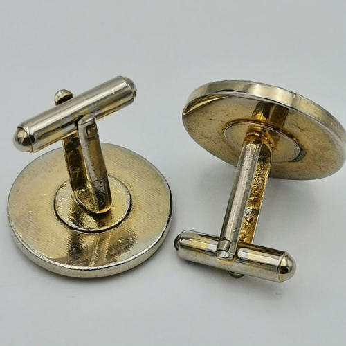 Pair of South African Airways flying springbok cufflinks with blue background