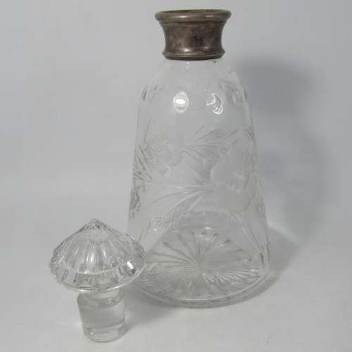 Beautiful vintage glass decanter with silver plated rim