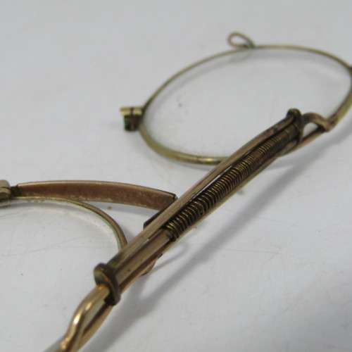 Antique gold coloured spectacle glasses in case