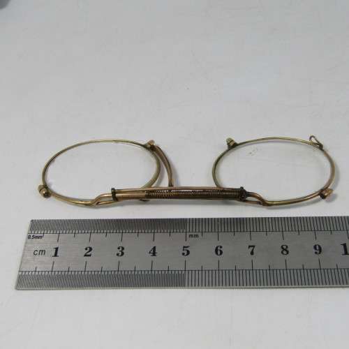 Antique gold coloured spectacle glasses in case