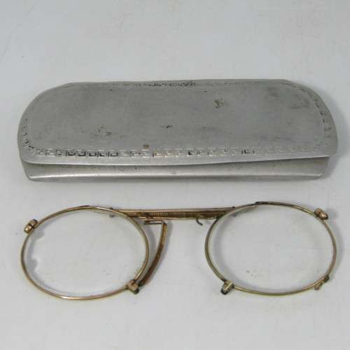 Antique gold coloured spectacle glasses in case