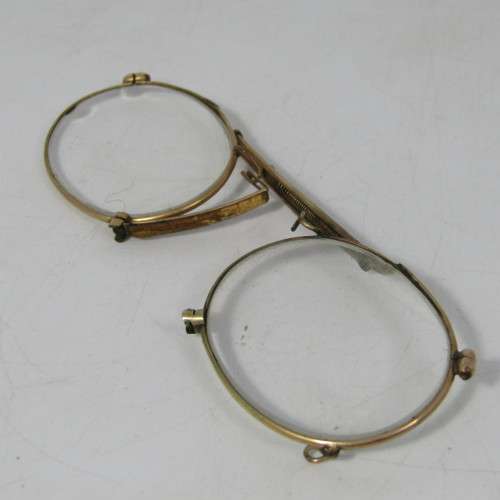 Antique gold coloured spectacle glasses in case
