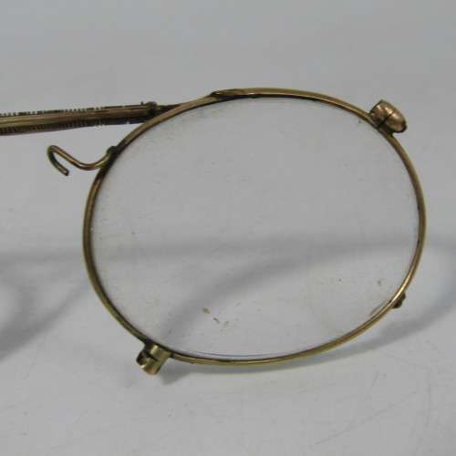 Antique gold coloured spectacle glasses in case