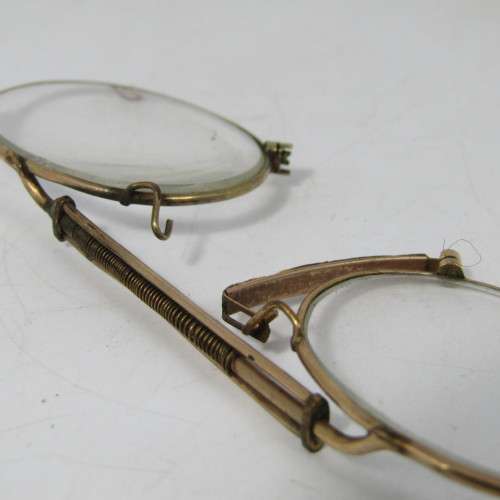 Antique gold coloured spectacle glasses in case