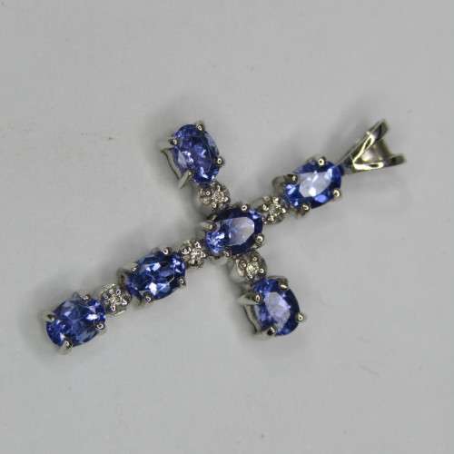 9kt white gold cross with 5 diamonds and 6 oval tanzanites or Iolites