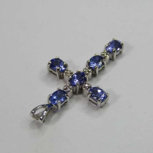 9kt white gold cross with 5 diamonds and 6 oval tanzanites or Iolites