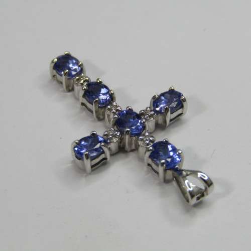 9kt white gold cross with 5 diamonds and 6 oval tanzanites or Iolites