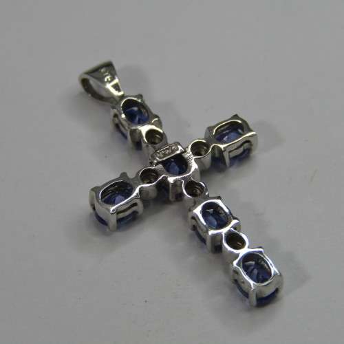9kt white gold cross with 5 diamonds and 6 oval tanzanites or Iolites