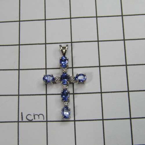 9kt white gold cross with 5 diamonds and 6 oval tanzanites or Iolites