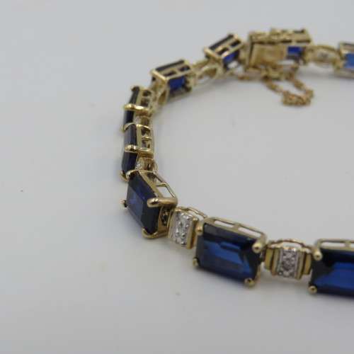 9kt bracelet with 10 diamonds and 16 rectangular blue sapphires ( not tested if natural)
