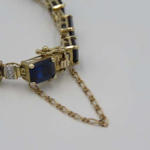 9kt bracelet with 10 diamonds and 16 rectangular blue sapphires ( not tested if natural)