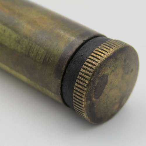 Vintage .303 brass oil bottle with markings on botton