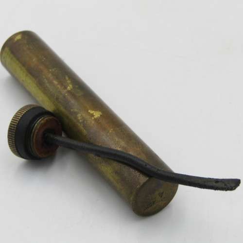 Vintage .303 brass oil bottle with markings on botton