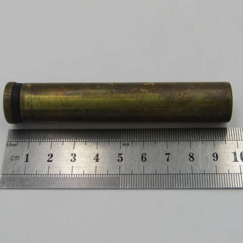 Vintage .303 brass oil bottle with markings on botton