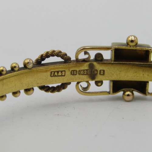 Antique 15kt gold bangle with 0,10ct diamond and two rubies - weighs 7,5 grams - circumference 17 cm