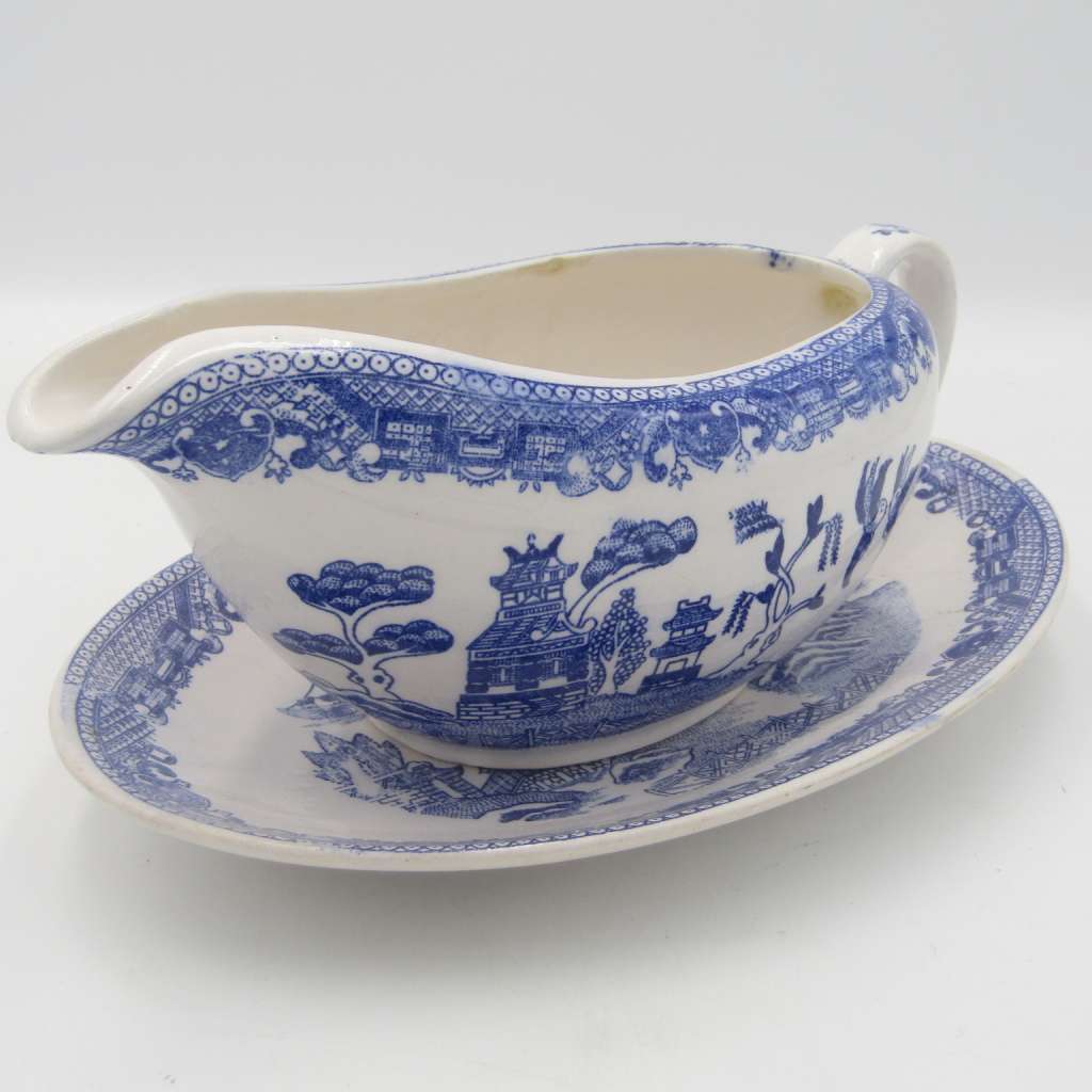 Antique Willow Pattern sauce boat and saucer