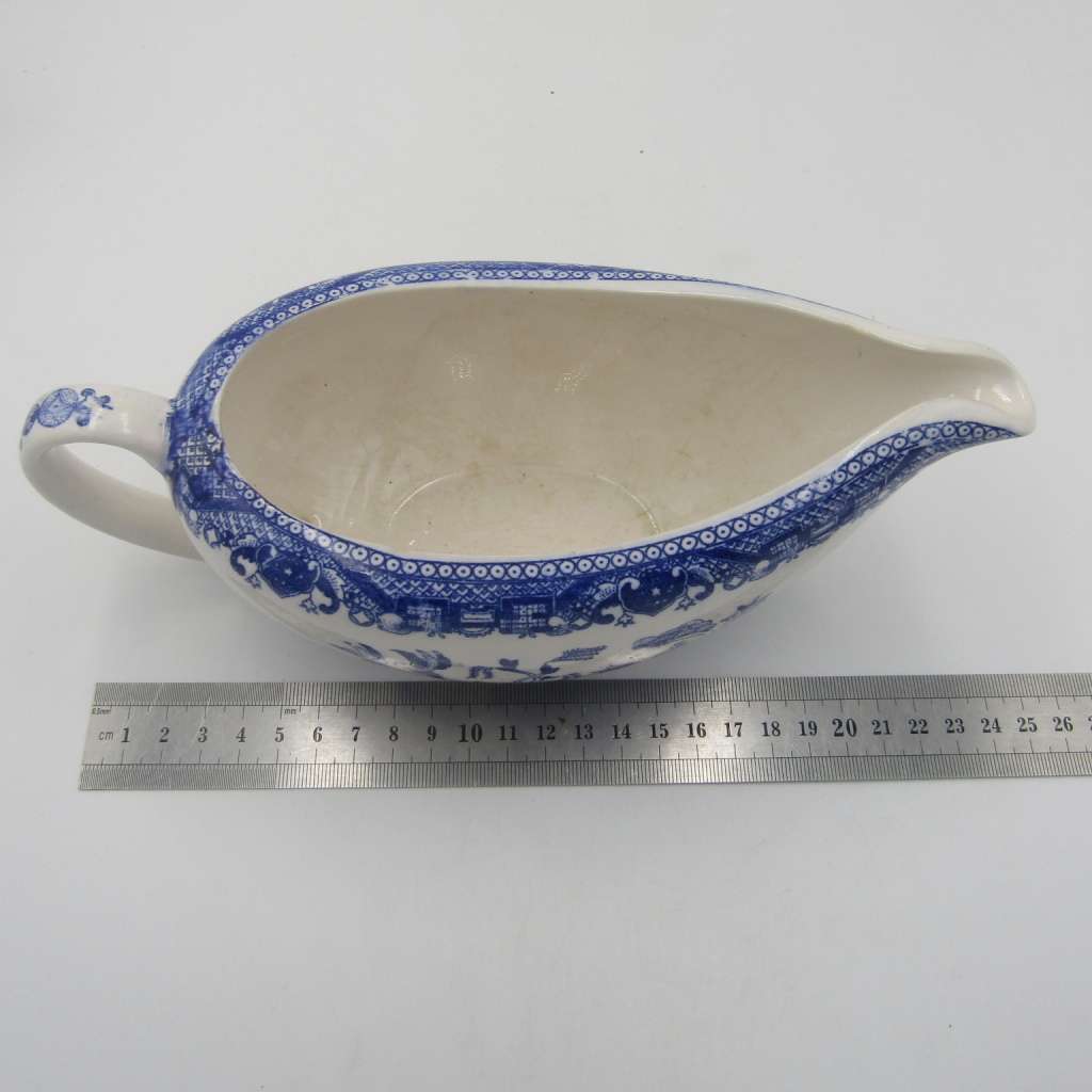 Antique Willow Pattern sauce boat and saucer