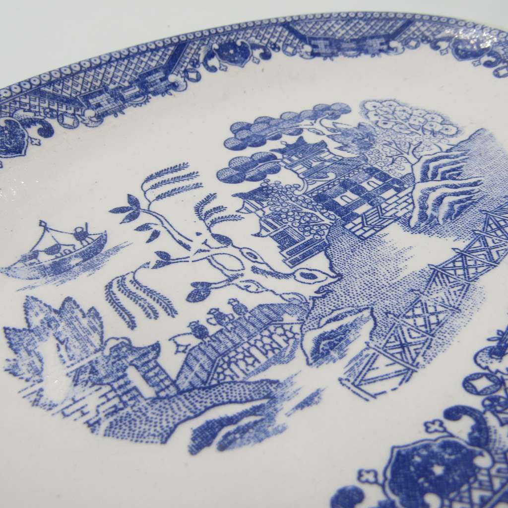 Antique Willow Pattern sauce boat and saucer