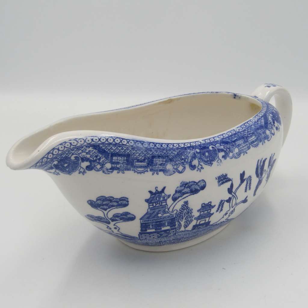 Antique Willow Pattern sauce boat and saucer