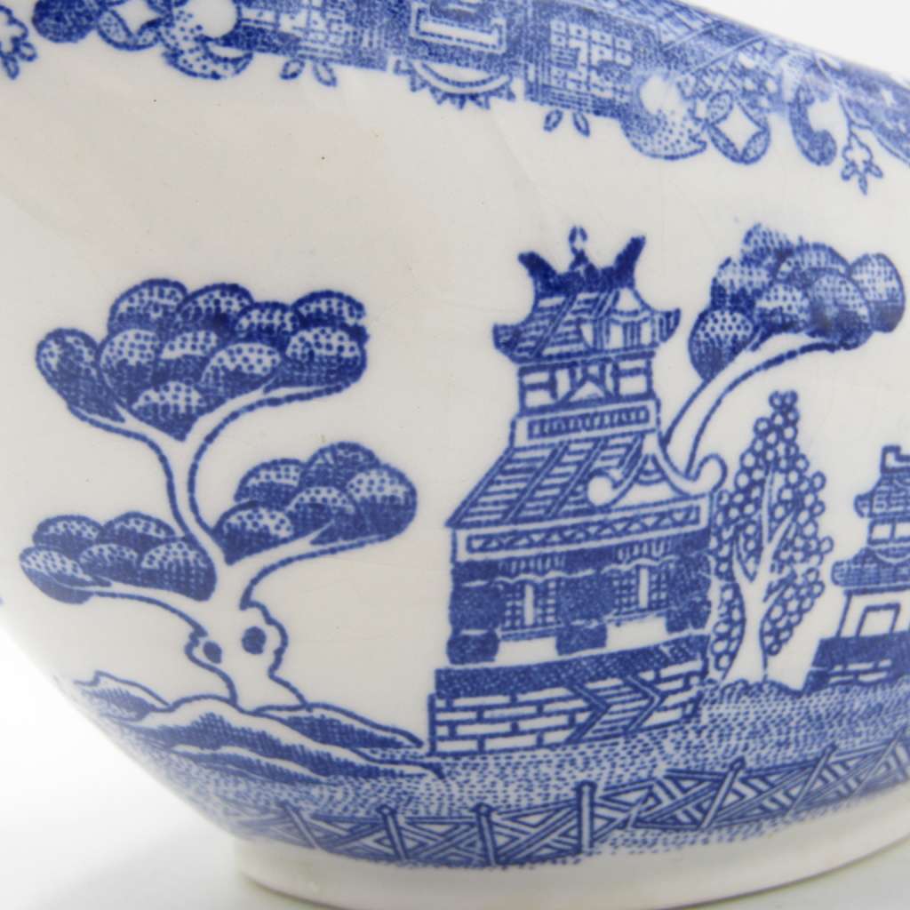 Antique Willow Pattern sauce boat and saucer