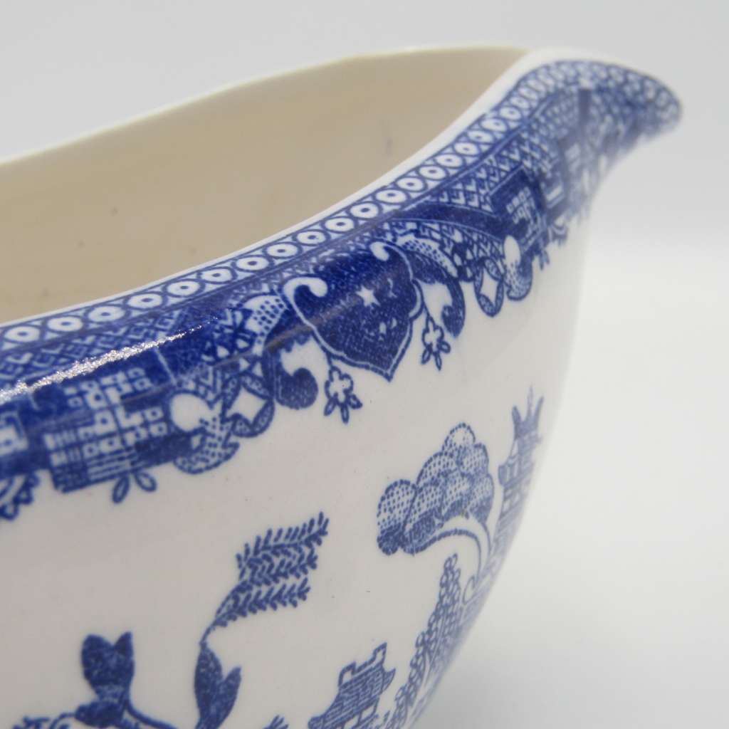 Antique Willow Pattern sauce boat and saucer