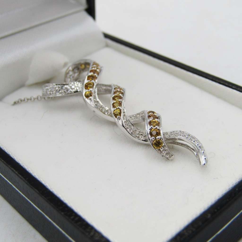 18kt White gold pendant with diamonds and yellow sapphires with 9kt white gold necklace