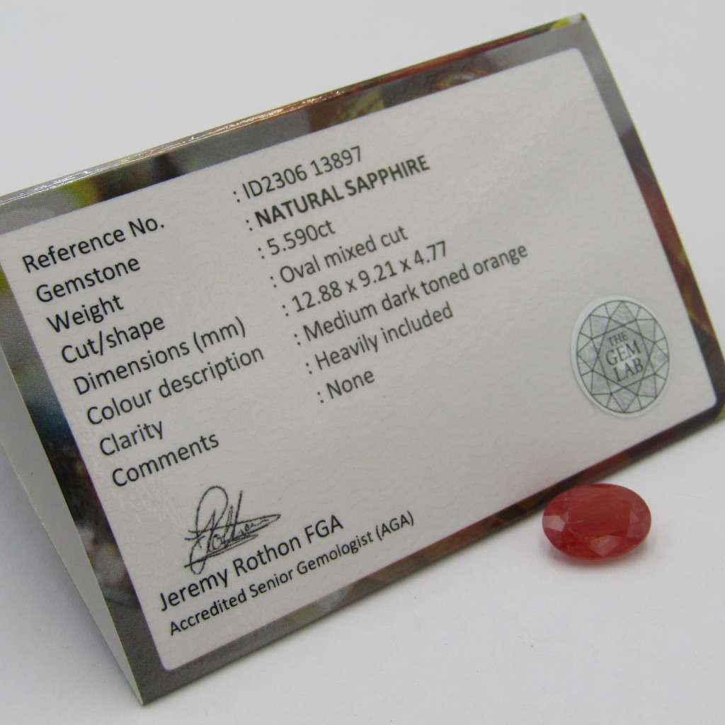 Natural Sapphire of 5,59 carat - oval mixed cut medium dark toned orange with Gemlab certificate
