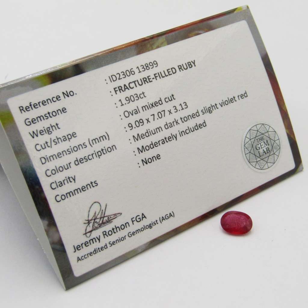 Fracture-filled Ruby of 1,9 carat oval mixed cut slight violet red with Gemlab certificate