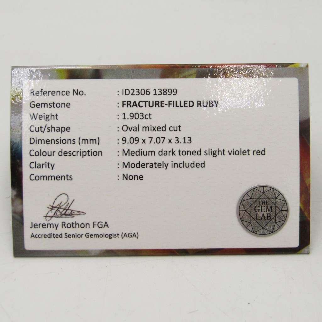 Fracture-filled Ruby of 1,9 carat oval mixed cut slight violet red with Gemlab certificate
