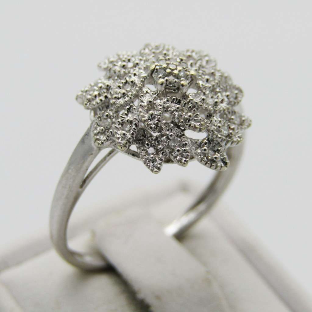 9kt White gold ring with about 30 small diamonds - ring size P