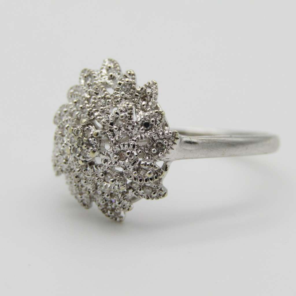 9kt White gold ring with about 30 small diamonds - ring size P