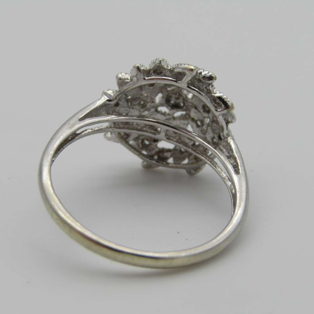 9kt White gold ring with about 30 small diamonds - ring size P