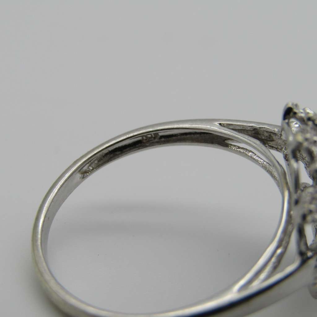 9kt White gold ring with about 30 small diamonds - ring size P