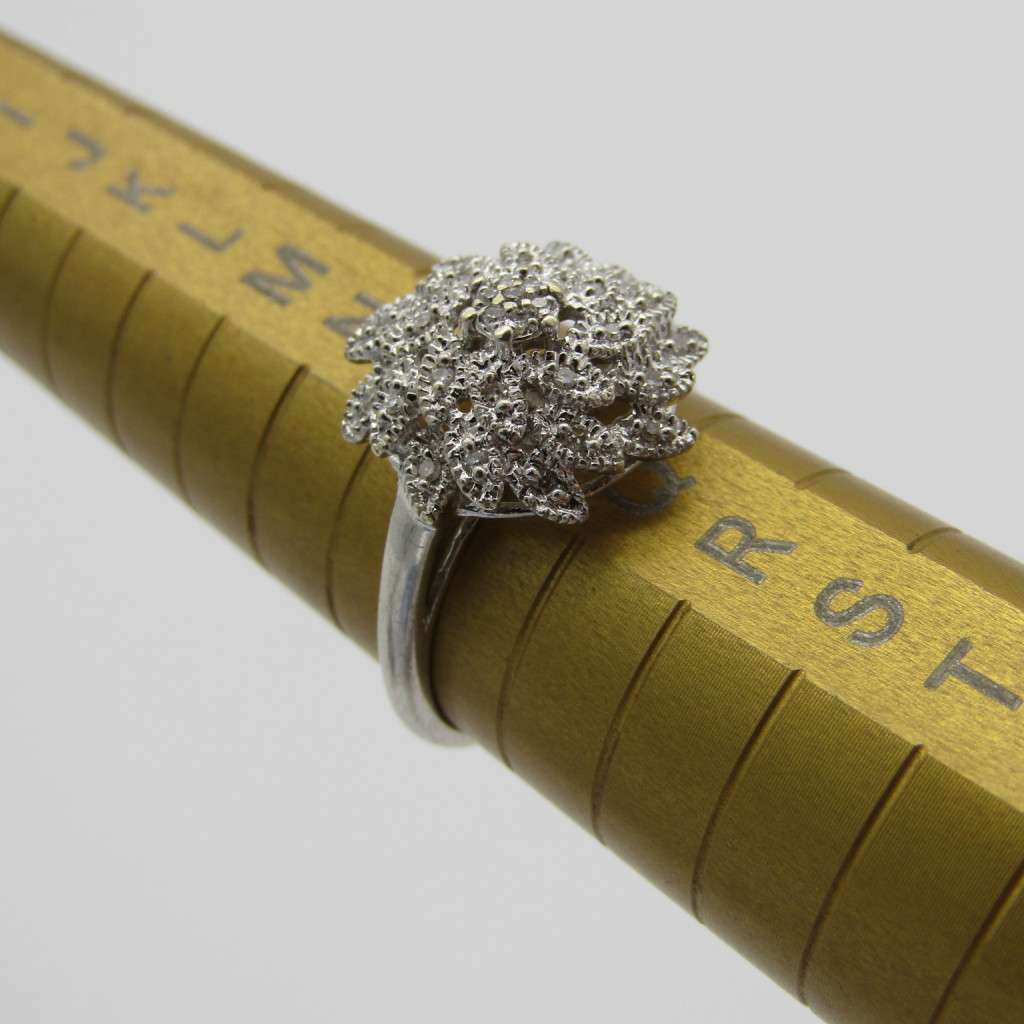 9kt White gold ring with about 30 small diamonds - ring size P