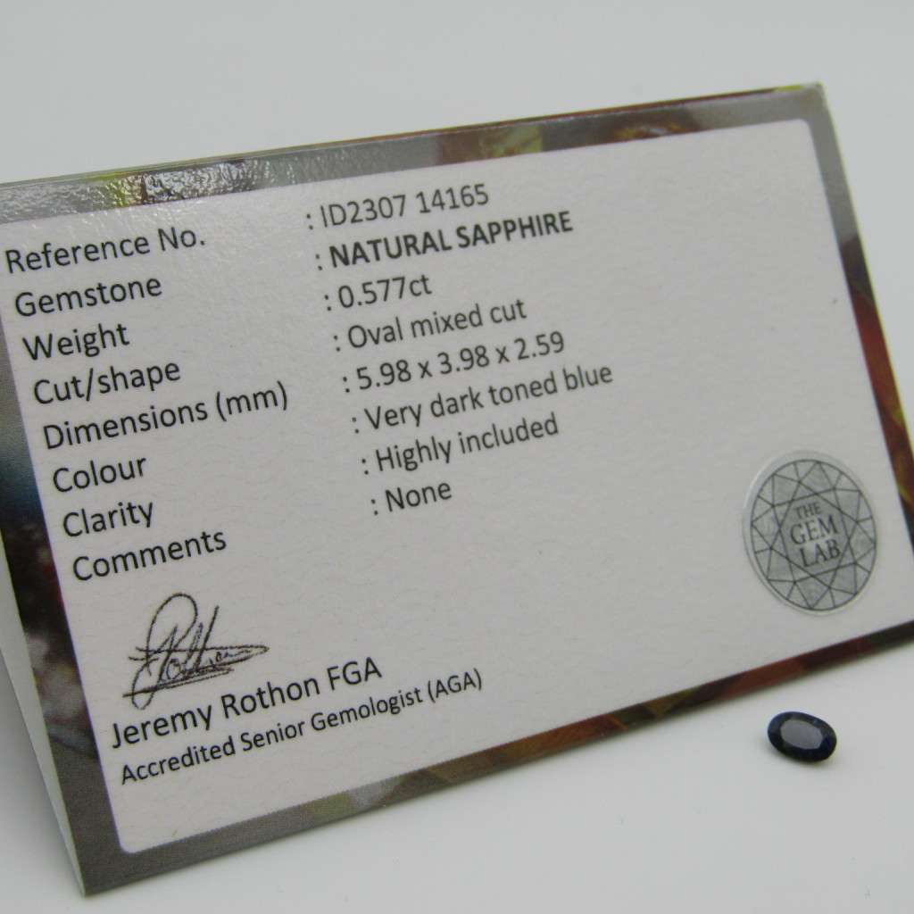 Natural Sapphire of 0,57 carat very dark toned blue - oval mixed cut with Gemlab certificate