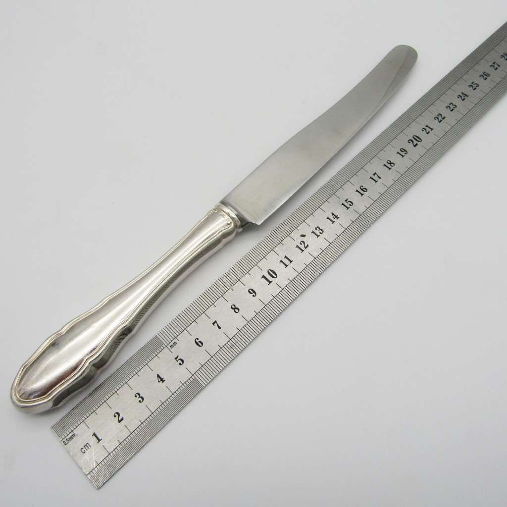 100 KKS German cutlery set with 11 knives / 12 forks / 11 spoons plated with about 140g of silver