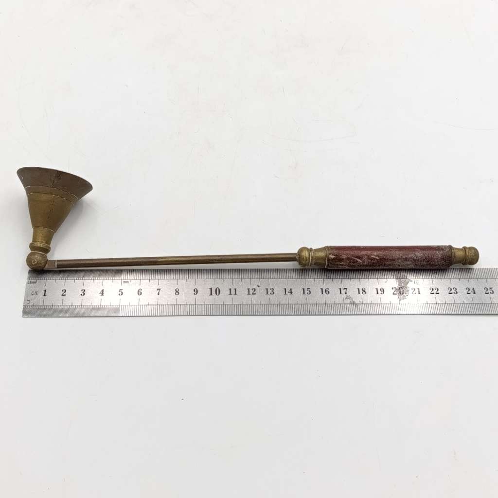 Vintage brass candle snuffer with wooden handle