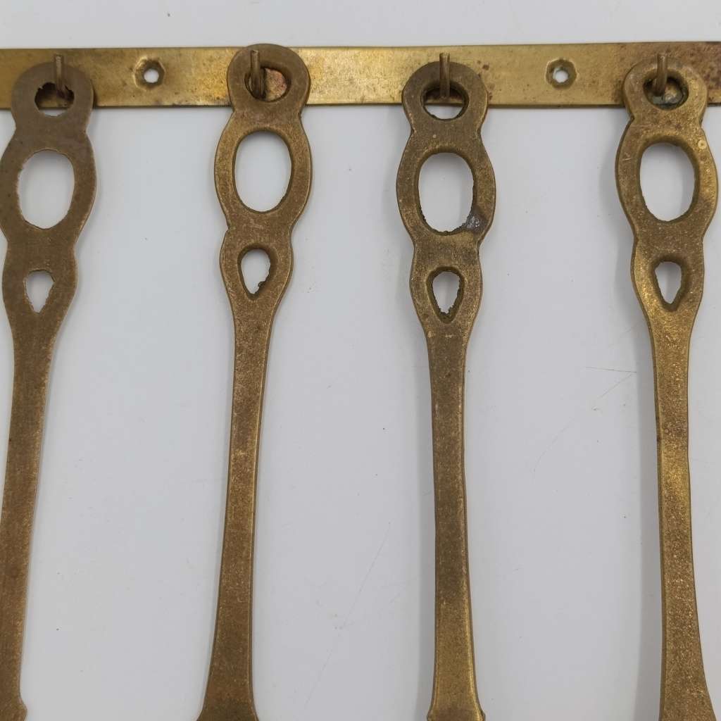 Set of vintage brass wall hanging utensils