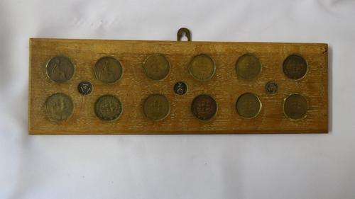 Wooden plaque with old South African and English coins - as per photo