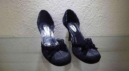 In Wear black high heels covered with lace - excellent condition(price reduced with R50)