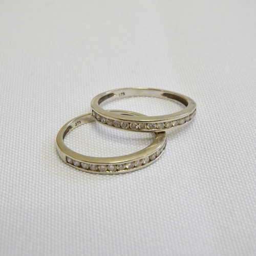 Pair of 9kt White Gold wedding bands - each band with 16 small diamonds - Size: M1/2 Weighs: 2.3g