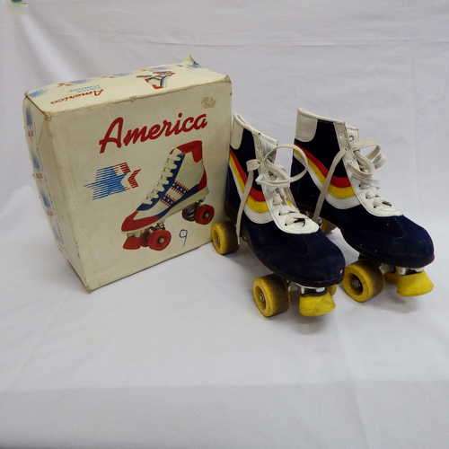 America size 10 1/2 roller skates in original box - in good condition