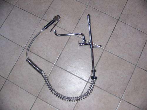 Sink mixer for restaurant sink with hand held spray cleaning head.