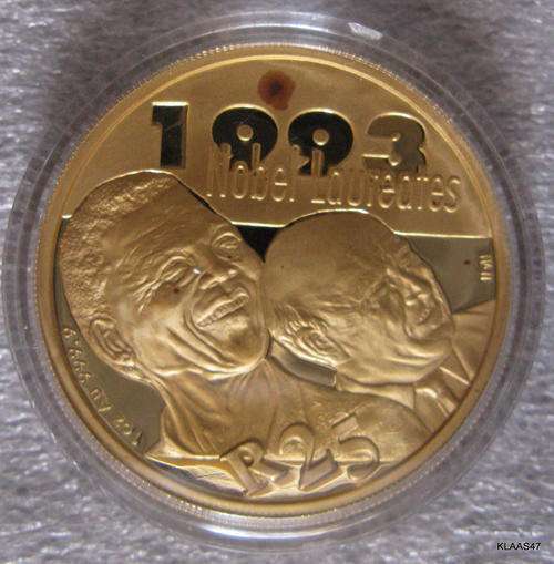 The 2007 24ct GOLD 1-OZ PROTEA Proof R25 (Nelson Mandela & FW de Klerk)** spot on coin