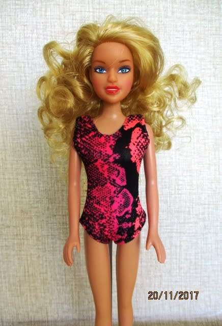 Barbie generic doll plus outfits.