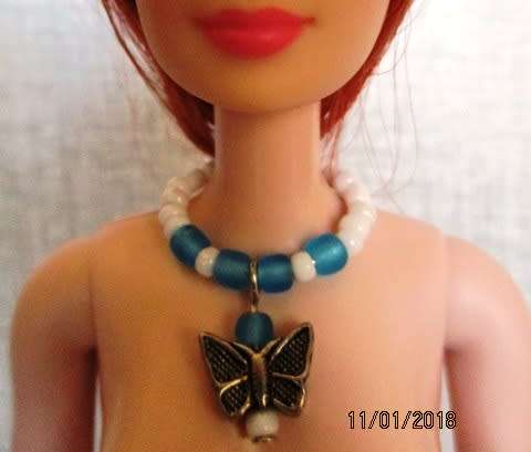 Barbie jewelry necklace with butterfly pendant and bracelet.